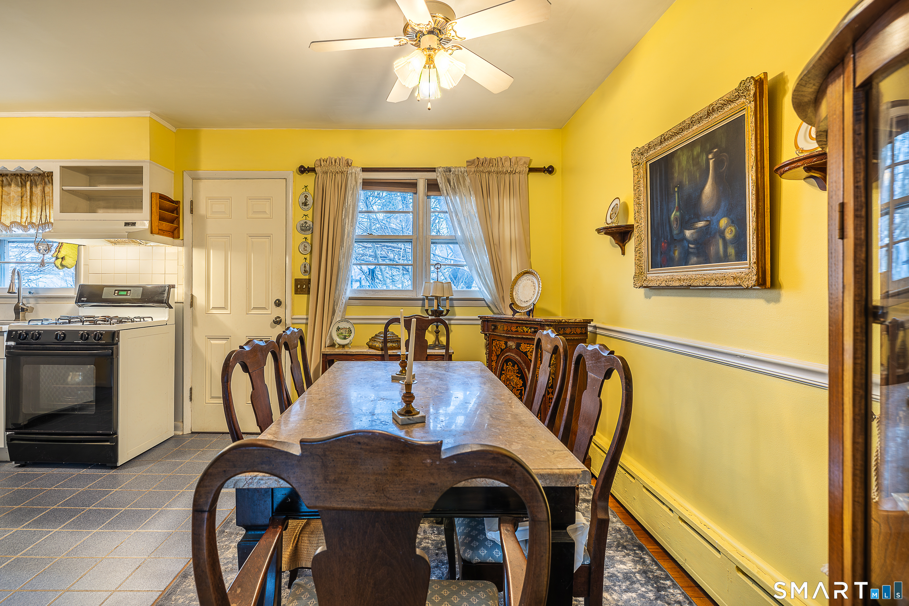 130 Holroyd Street Bridgeport, CT 06606 - Photo 8 of 29 a dining room with furniture and window