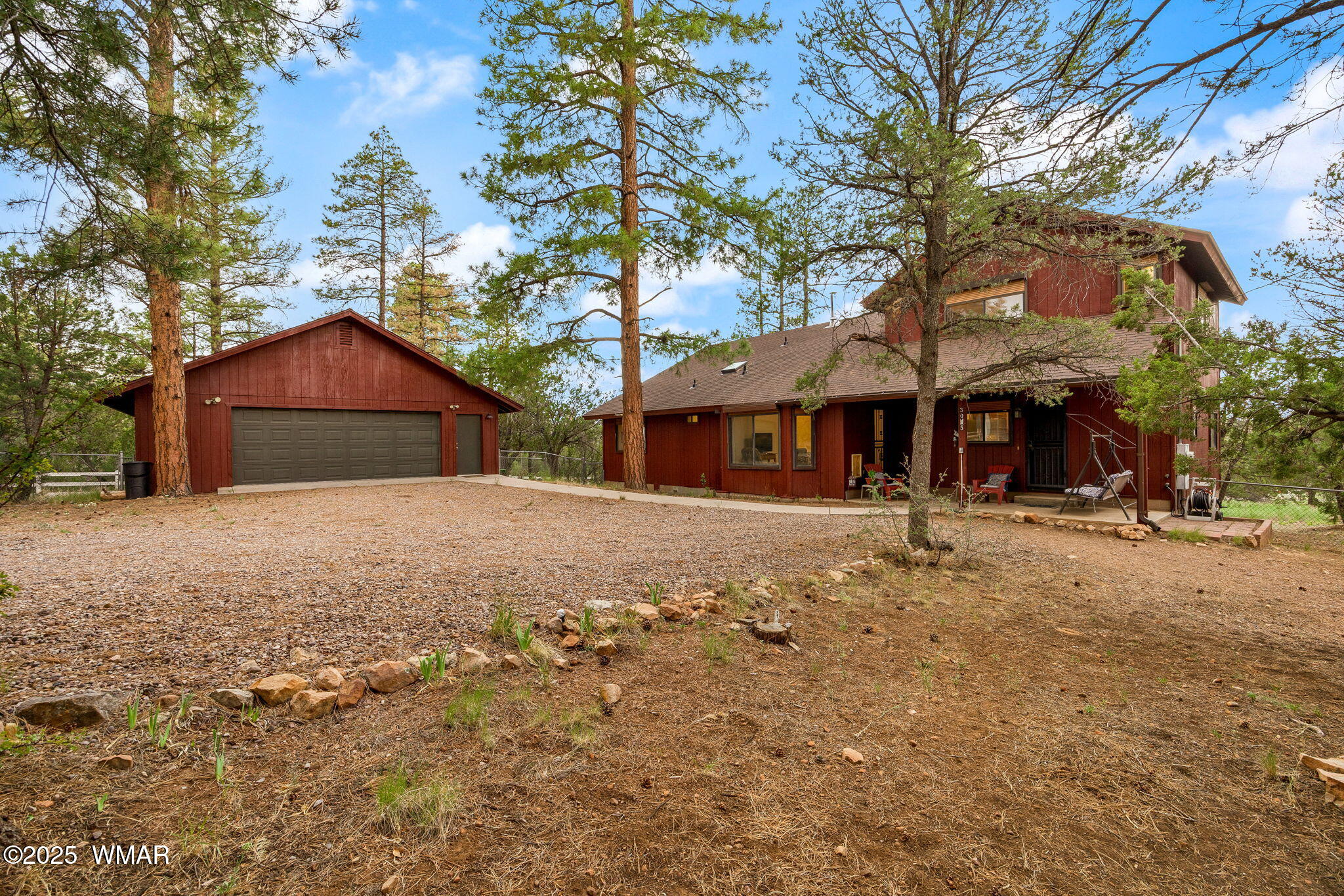 3045 Aspen Road Overgaard, AZ 85933 - Photo 1 of 42 a front view of a house with a yard