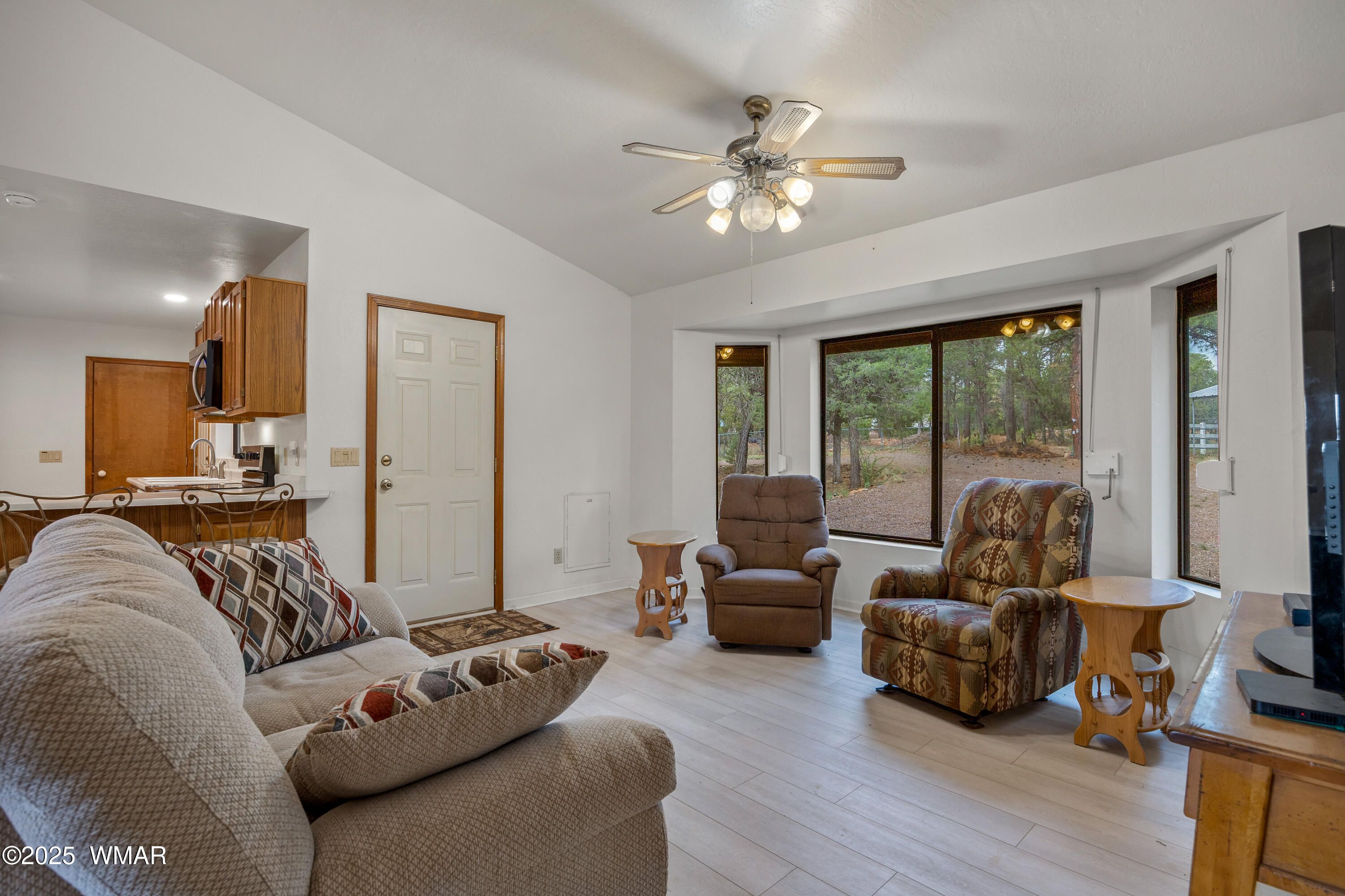 3045 Aspen Road Overgaard, AZ 85933 - Photo 8 of 42 a living room with furniture and a large window