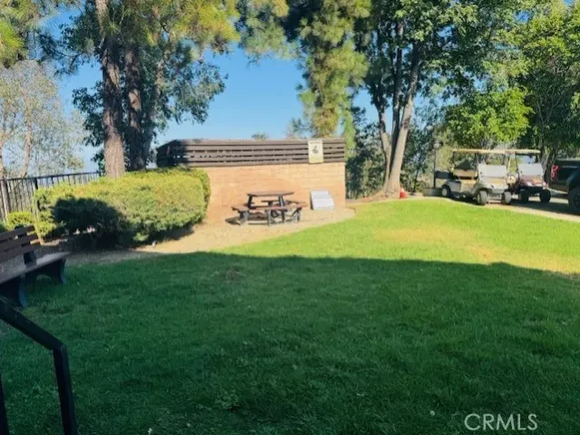 an aerial view of a house with a yard and garden