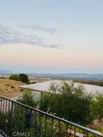 a view of a balcony with an outdoor space and seating area