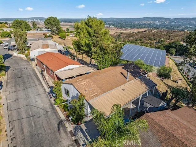 an aerial view of a houses with a yard
