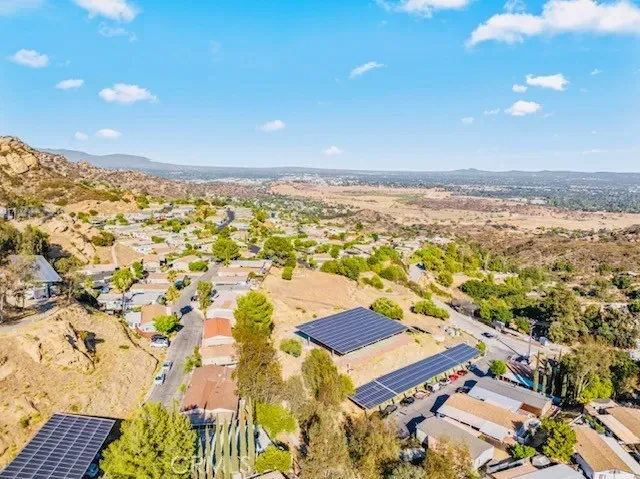 an aerial view of residential houses with outdoor space