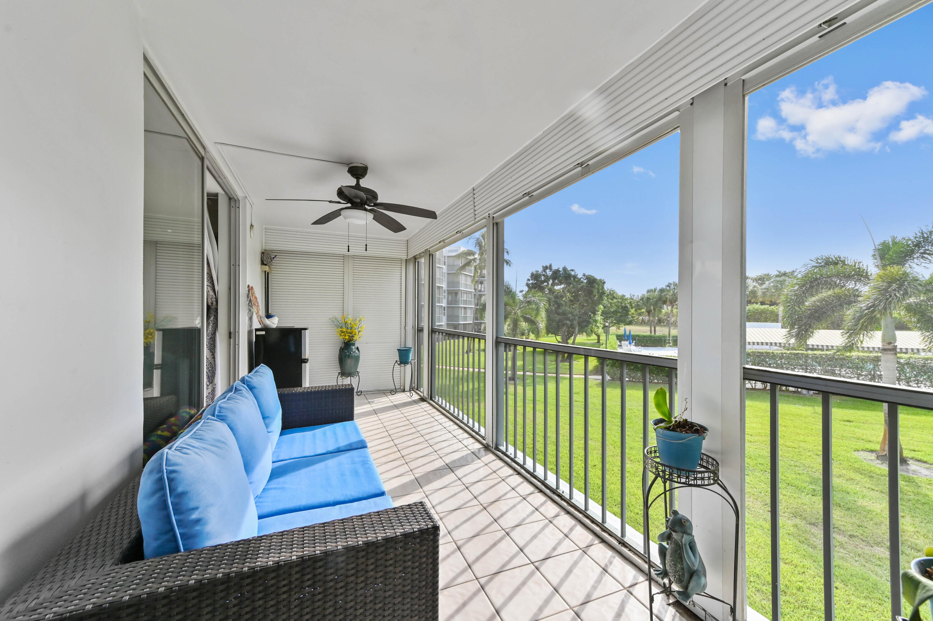 198 Northwest 67th Street, Unit 207 Boca Raton, FL 33487 - Photo 31 of 42 a living room with furniture and a large window