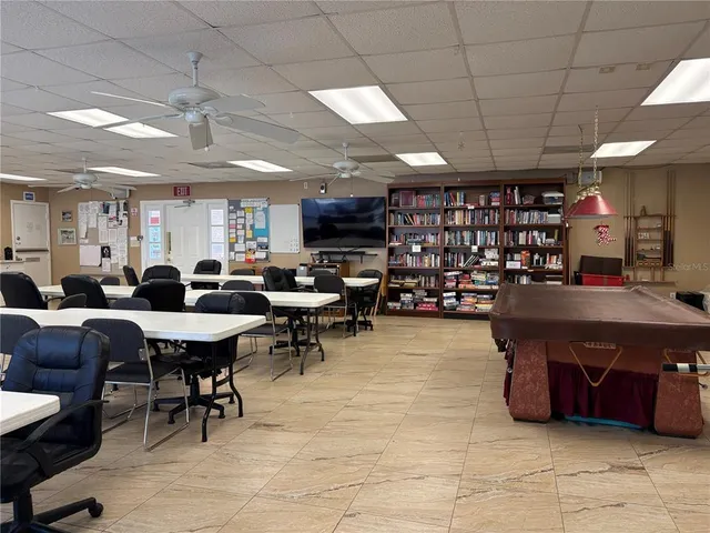 a living room with lots of furniture and a table