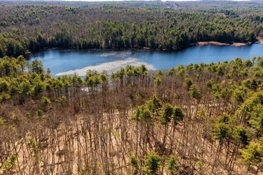 a view of lake with green space