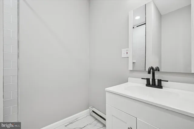 a bathroom with a sink and a mirror