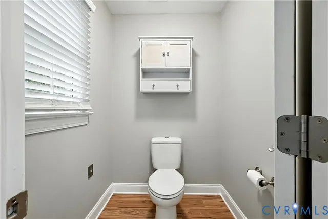 a bathroom with a toilet and a sink