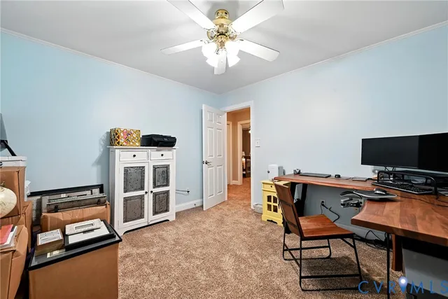 a bedroom with furniture and a flat screen tv