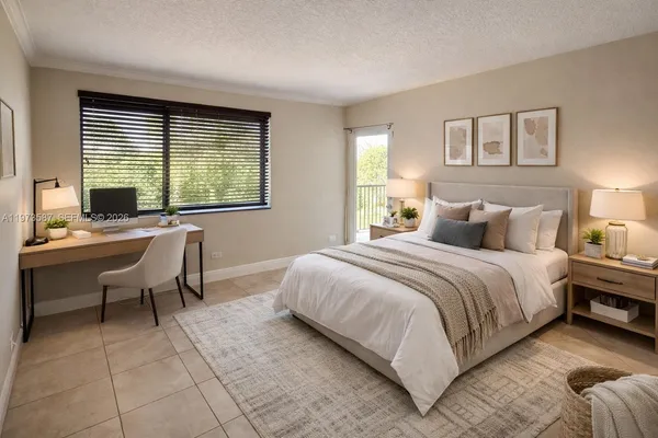 a bedroom with a bed and a desk