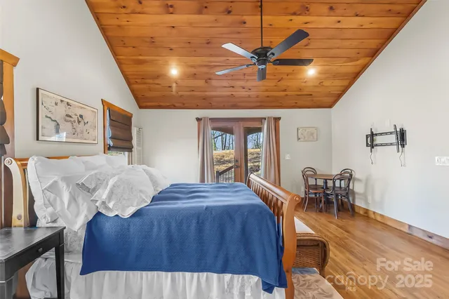 a bed room with a bed and a chandelier