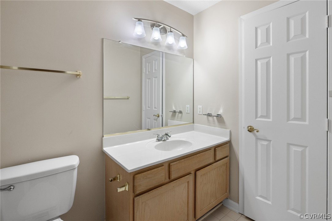 910 Masters Row, Unit J Glen Allen, VA 23059 - Photo 14 of 17 a bathroom with a sink toilet and vanity