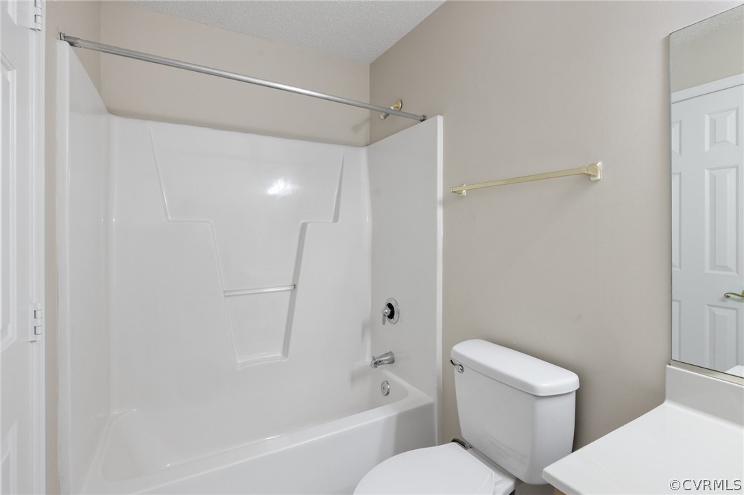 910 Masters Row, Unit J Glen Allen, VA 23059 - Photo 15 of 17 a bathroom with a toilet and a bathtub