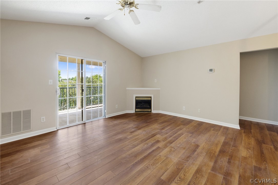 910 Masters Row, Unit J Glen Allen, VA 23059 - Photo 2 of 17 a view of empty room with wooden floor and fan