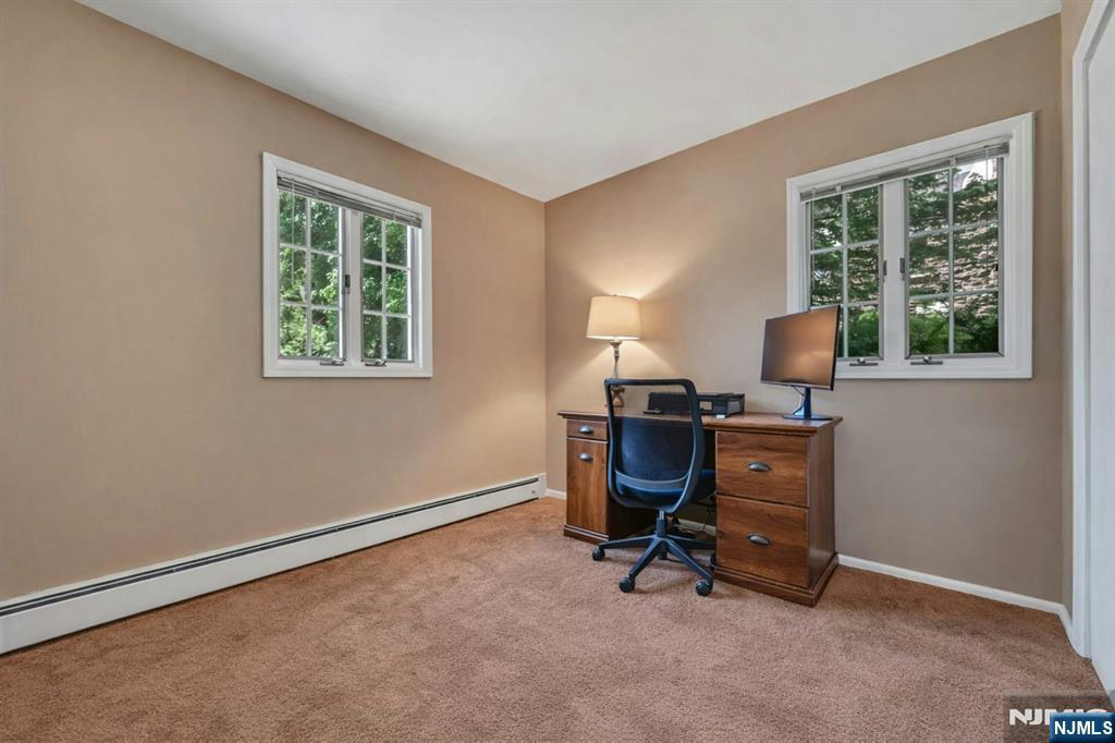44 West Midland Avenue Paramus, NJ 07652 - Photo 12 of 19 a view of a workspace with furniture and a window