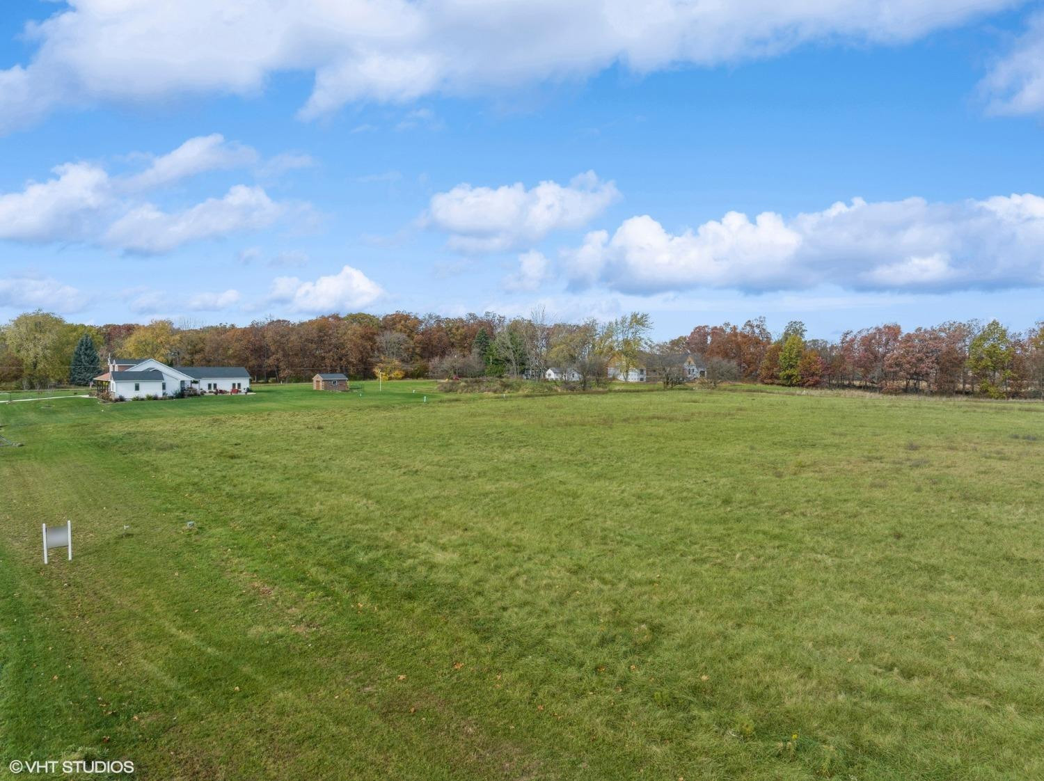 595 West 213 South Hebron, IN 46341 - Photo 21 of 25 a view of a field with an ocean and mountain view