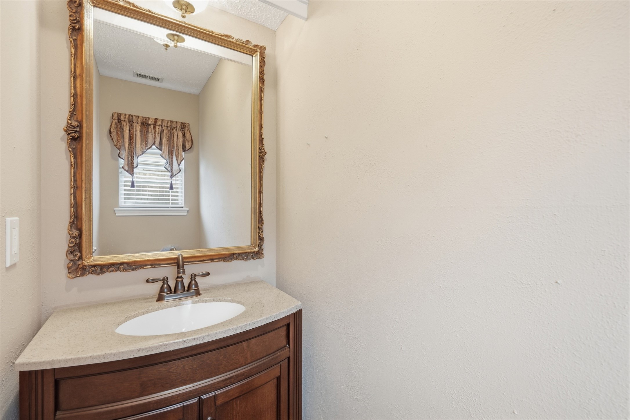 8310 Mentmore Drive Spring, TX 77379 - Photo 23 of 47 Conveniently located powder bath offers comfort and convenience for guests.