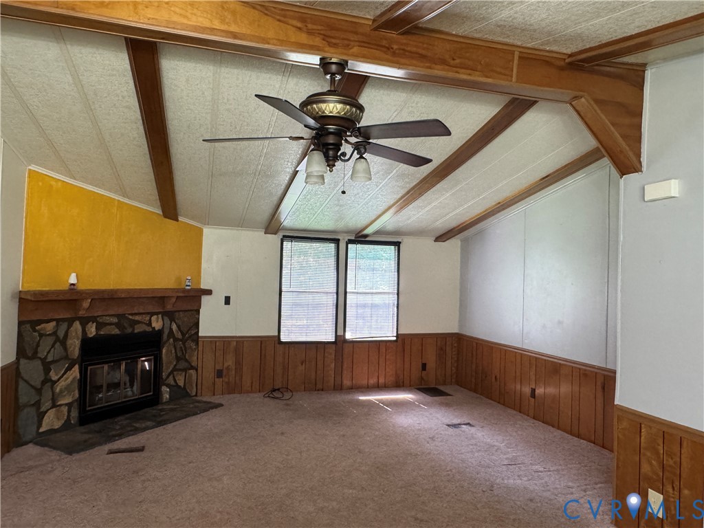 371 Horseshoe Road Jarratt, VA 23867 - Photo 8 of 21 Living area featuring a stone-clad fireplace with