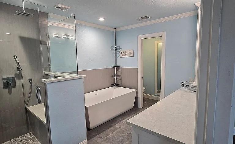 509 Royal Valley Road Grand Prairie, TX 75052 - Photo 13 of 22 a en suite bathroom with a granite countertop sink and a mirror