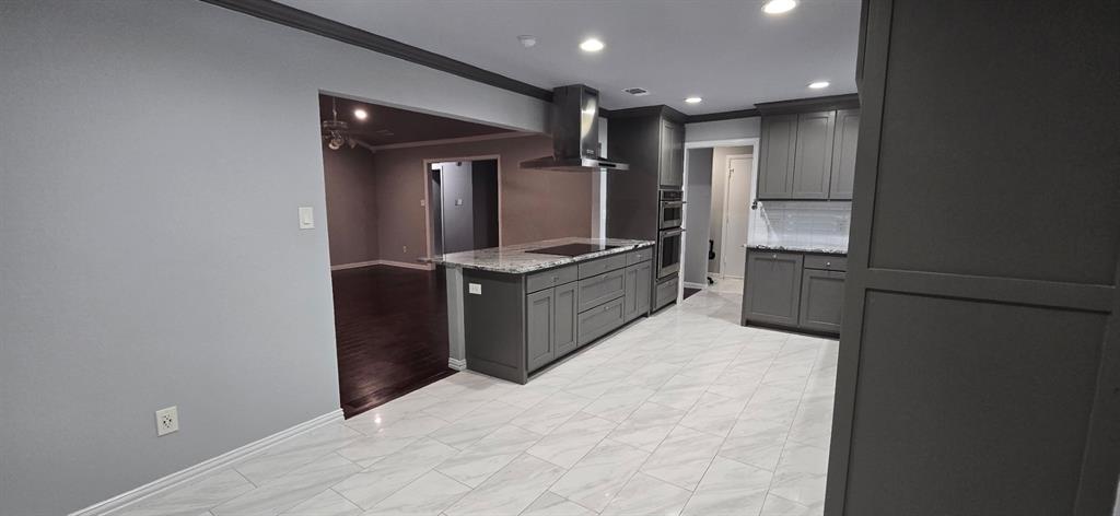 509 Royal Valley Road Grand Prairie, TX 75052 - Photo 2 of 22 a kitchen with stainless steel appliances granite countertop a refrigerator and a sink