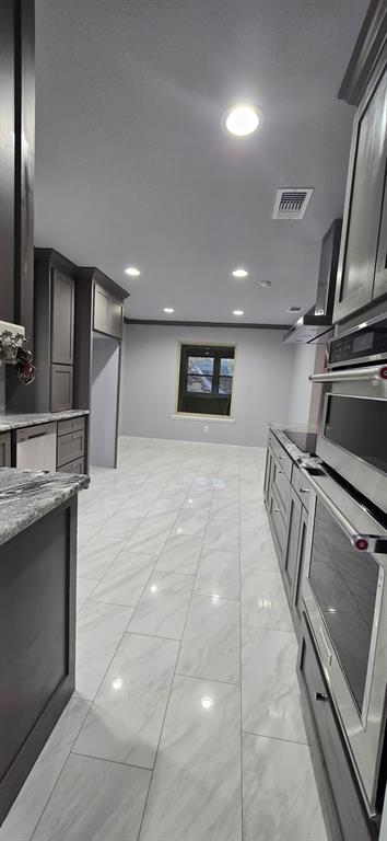 509 Royal Valley Road Grand Prairie, TX 75052 - Photo 4 of 22 a view of an empty room with wooden floor