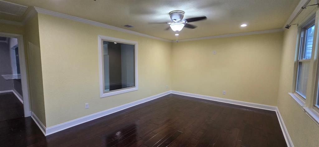 509 Royal Valley Road Grand Prairie, TX 75052 - Photo 9 of 22 wooden floor in an empty room with a window