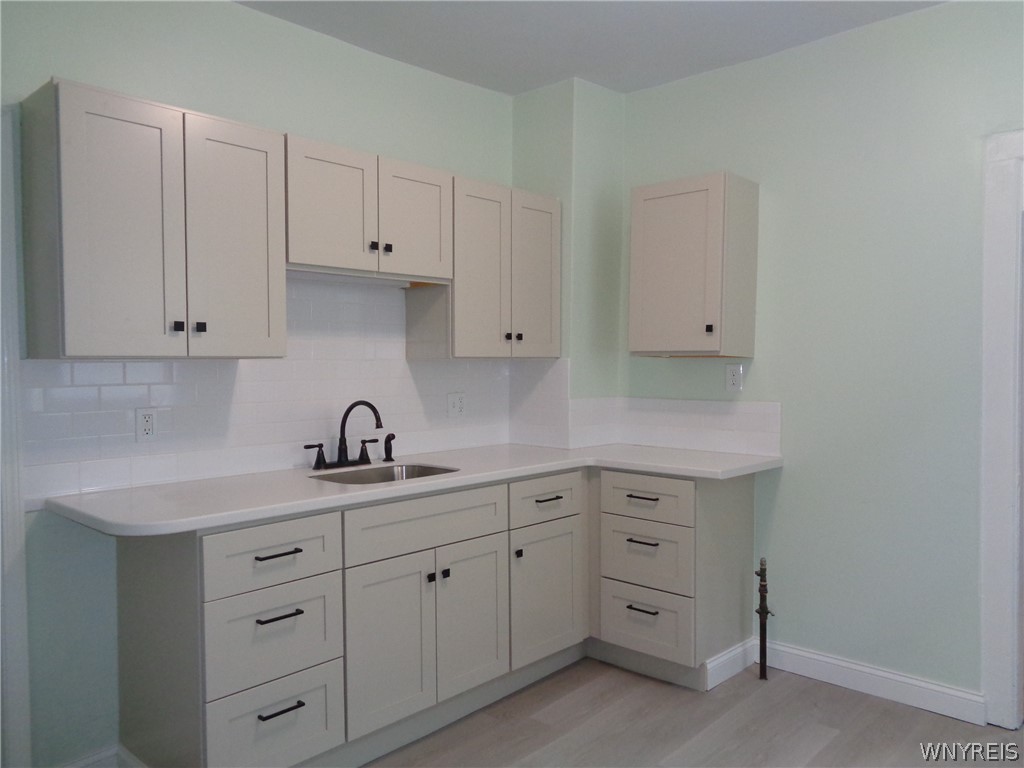 31 Riverside Avenue Buffalo, NY 14207 - Photo 18 of 46 Kitchen with brand new cabinets, countertop & back
