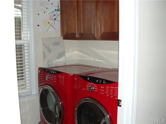 1908 Grace Point Road Morrisville, NC 27560 - Photo 16 of 22 Upstairs Laundry room just outside your Master Suite for convenience and on the 2nd floor with all bedrooms. Upper cabinets for storage! Laundry Room