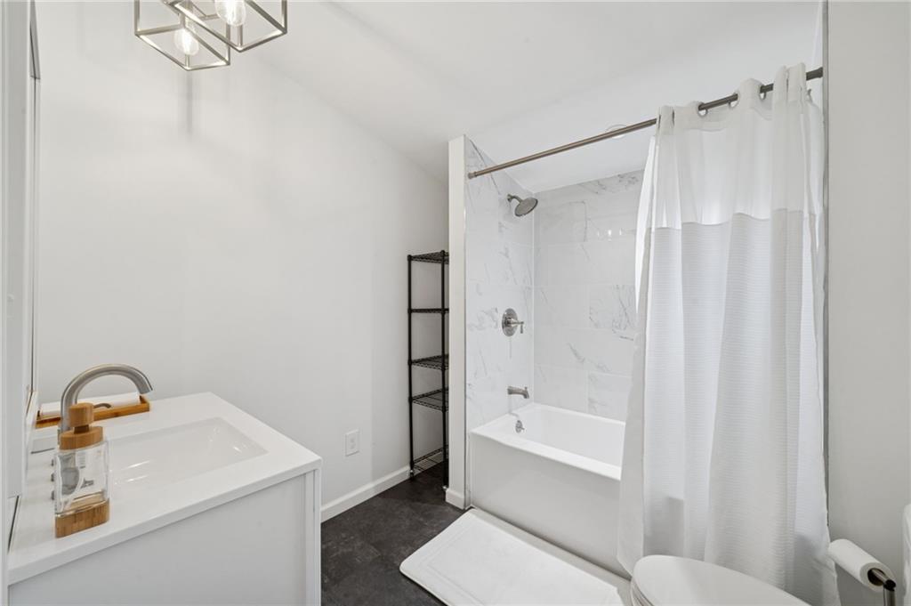 124 Oak Street Yukon, PA 15698 - Photo 14 of 35 a bathroom with a sink toilet and shower