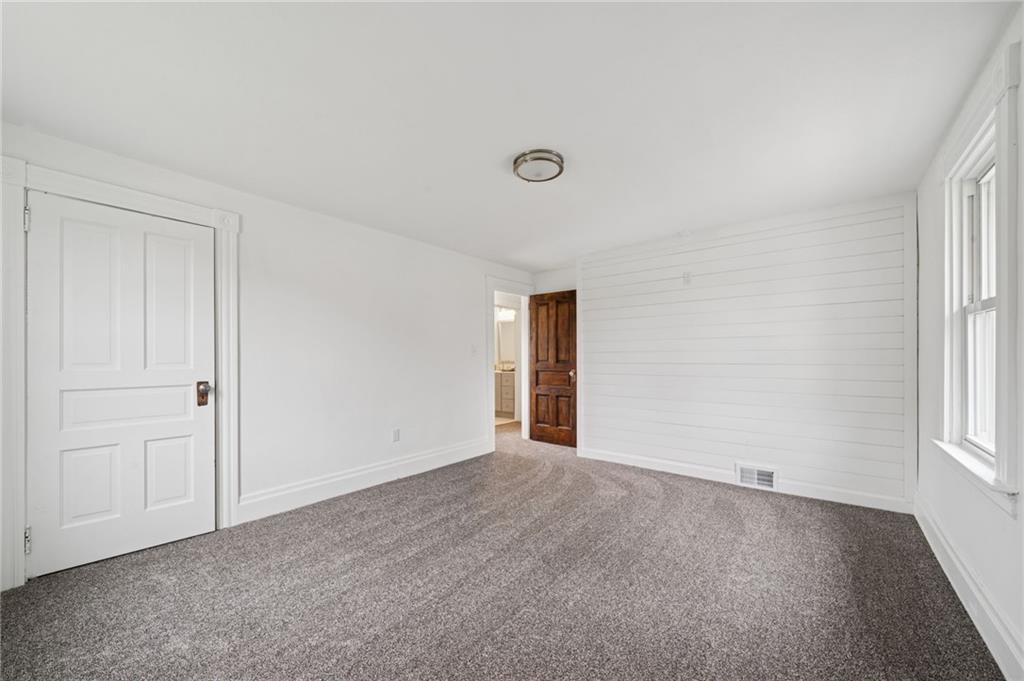 124 Oak Street Yukon, PA 15698 - Photo 23 of 35 a view of an empty room and a window