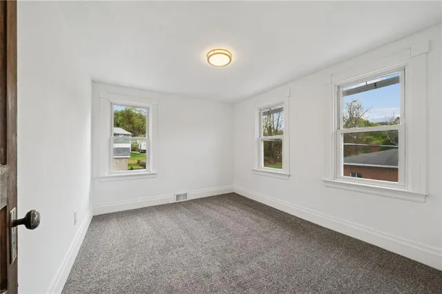 a view of walk in closet with natural light