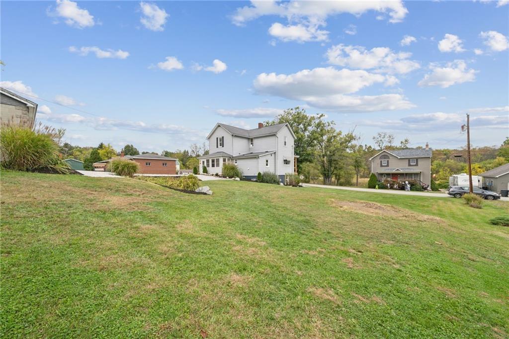 124 Oak Street Yukon, PA 15698 - Photo 33 of 35 a view of a garden with houses