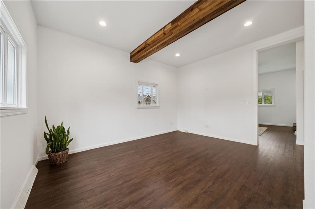 124 Oak Street Yukon, PA 15698 - Photo 9 of 35 an empty room with wooden floor and windows