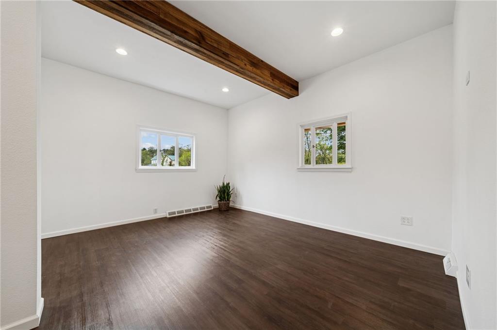 124 Oak Street Yukon, PA 15698 - Photo 10 of 35 a view of an empty room with wooden floor and a window