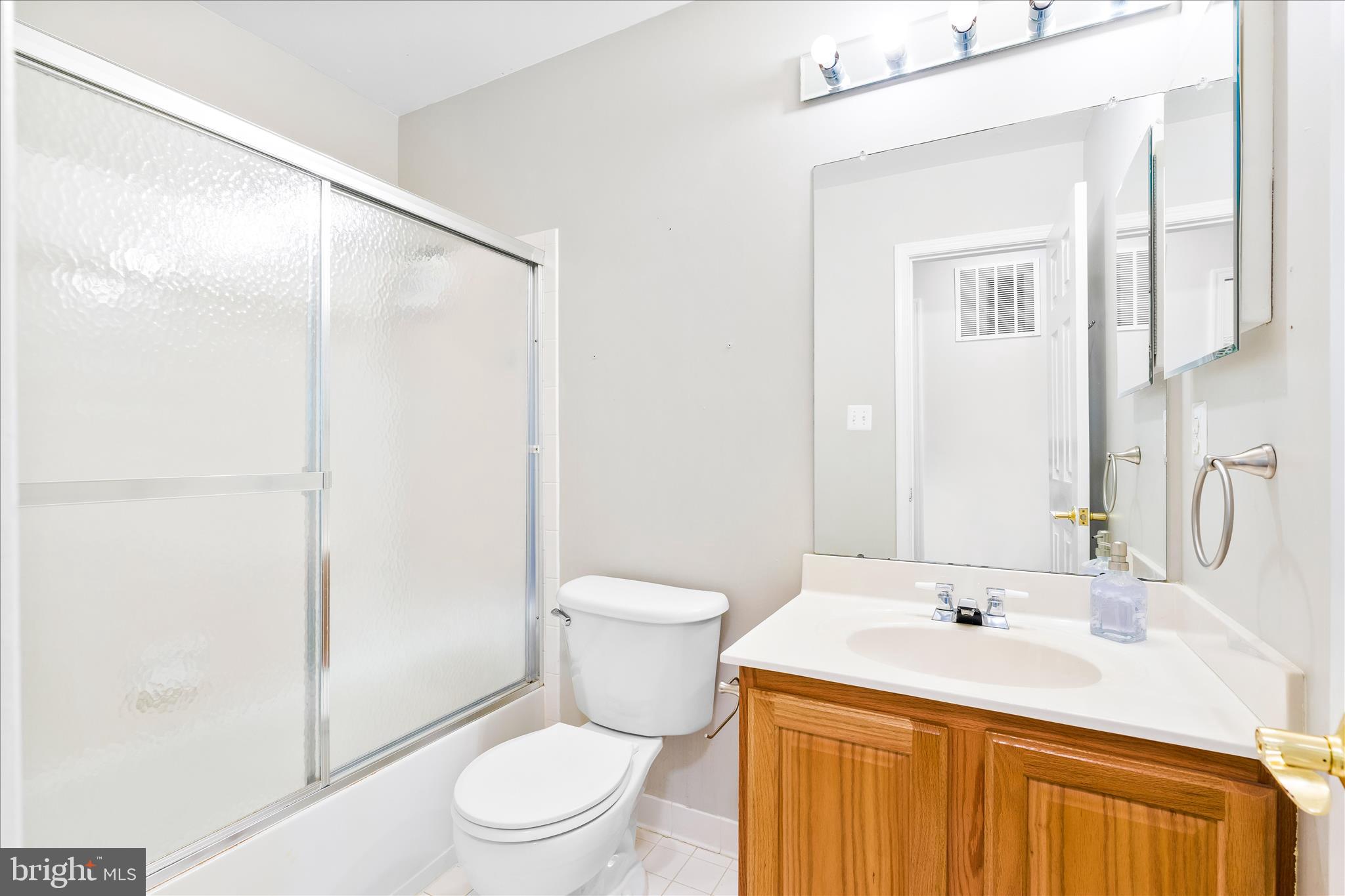 2442 Rippling Brook Road Frederick, MD 21701 - Photo 41 of 85 a bathroom with a sink a toilet and shower