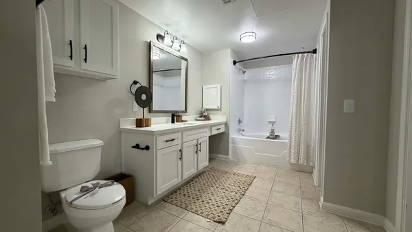 a kitchen with a sink cabinets and appliances