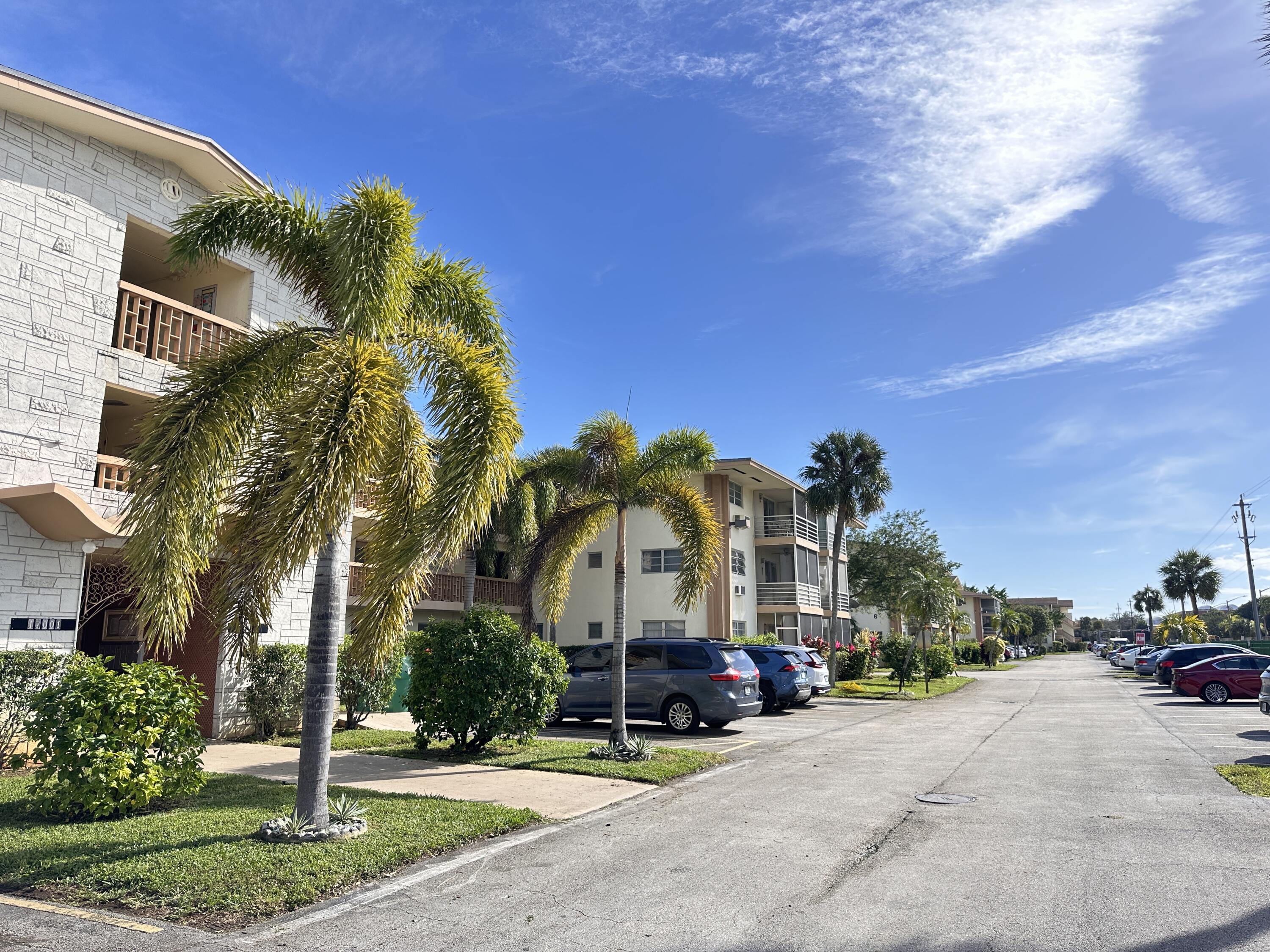 17001 Northeast 13th Avenue, Unit 205 Miami, FL 33162 - Photo 12 of 14 a view of a street with a building in the background