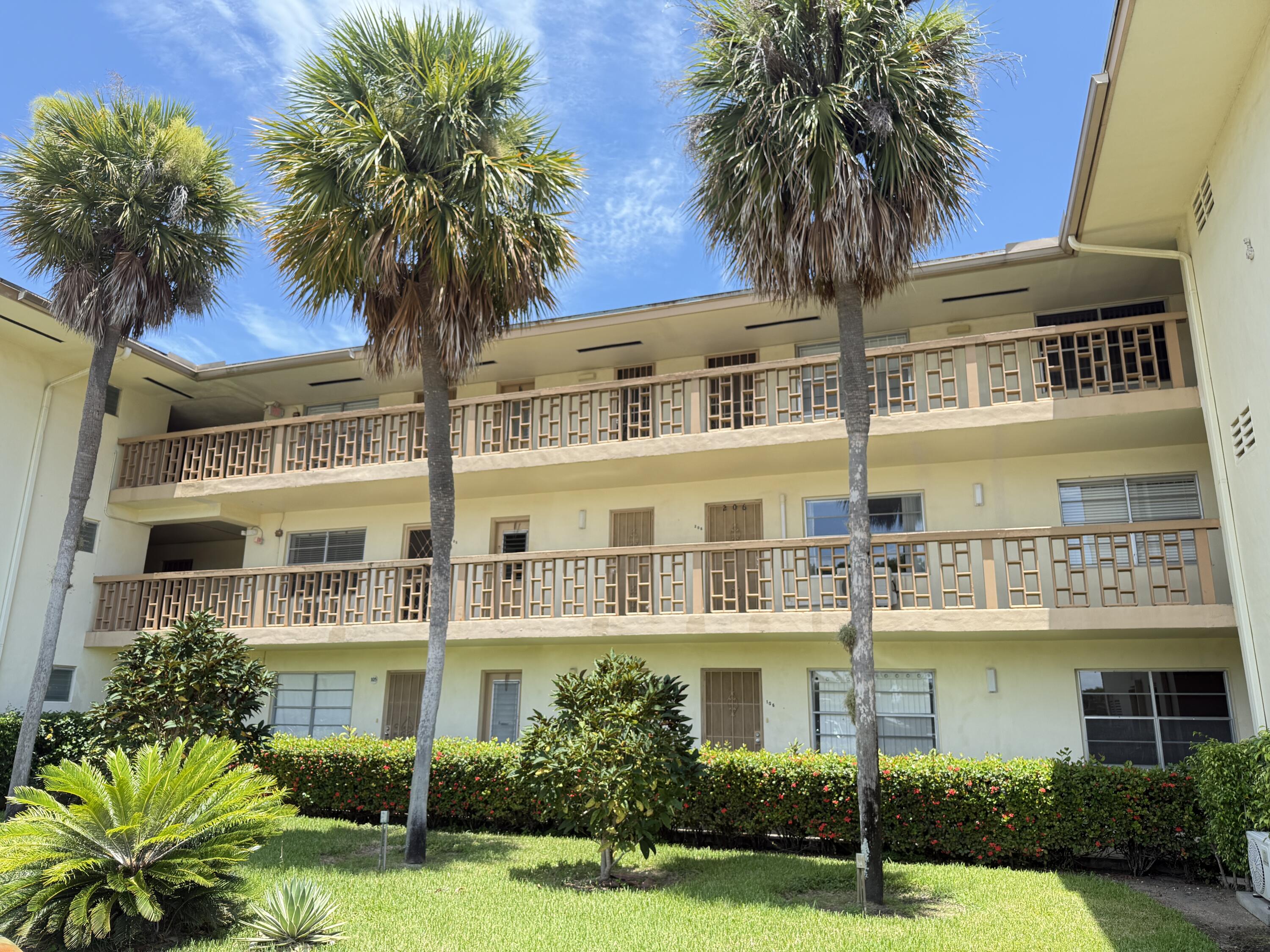 17001 Northeast 13th Avenue, Unit 205 Miami, FL 33162 - Photo 13 of 14 front view of a building