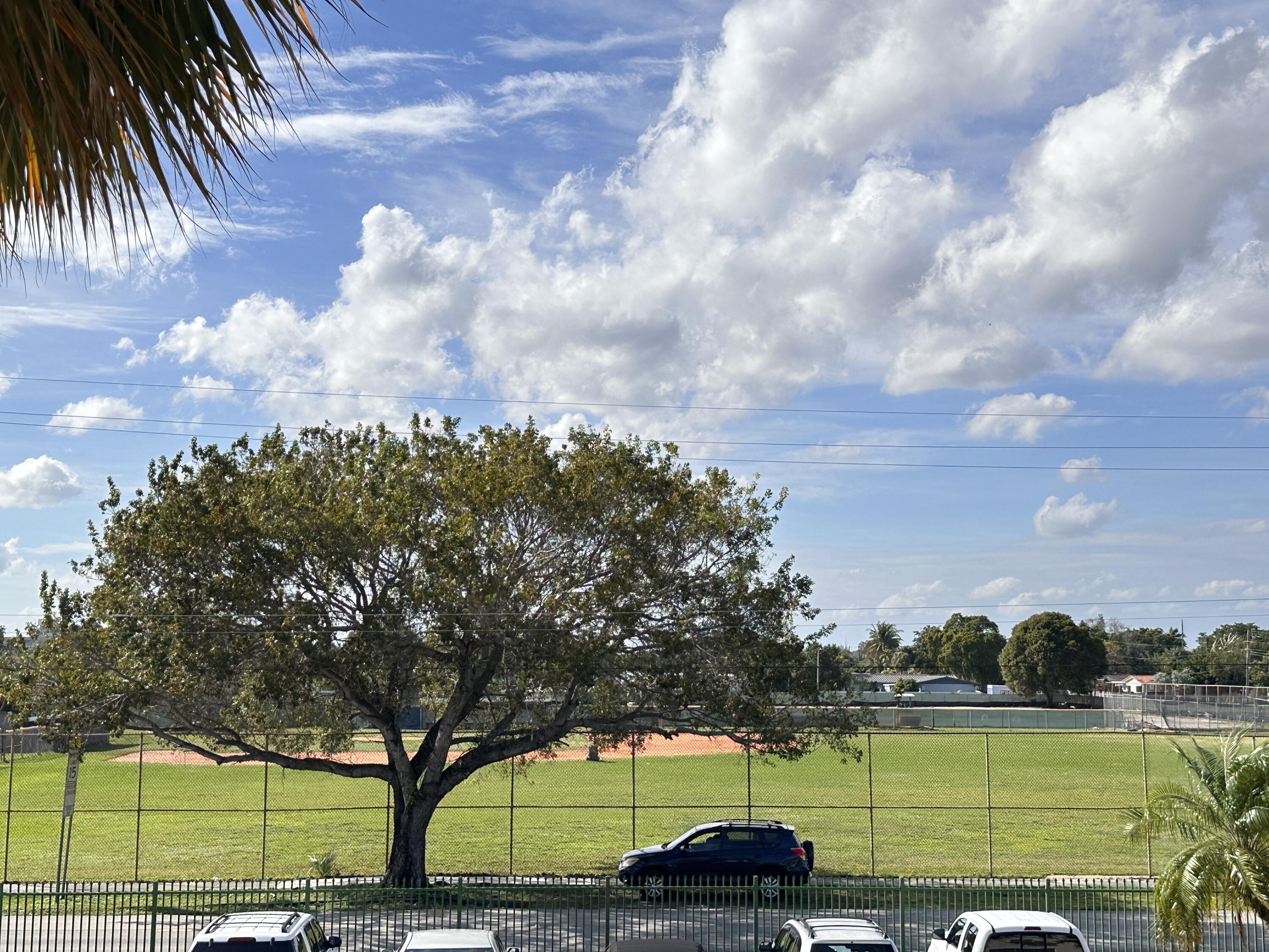 17001 Northeast 13th Avenue, Unit 205 Miami, FL 33162 - Photo 14 of 14 a view of a yard