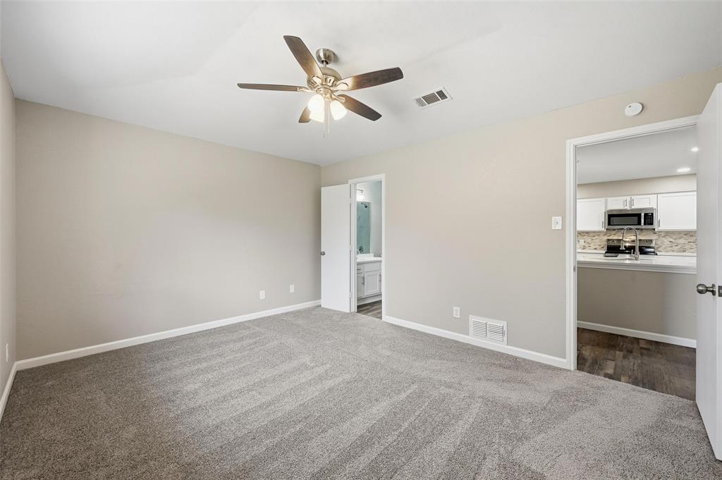705 Timberoaks Drive Azle, TX 76020 - Photo 11 of 27 a view of an empty room with a kitchen