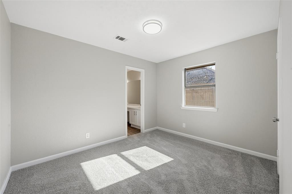 705 Timberoaks Drive Azle, TX 76020 - Photo 13 of 27 a view of an empty room with a window