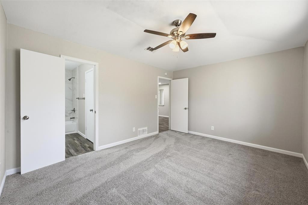 705 Timberoaks Drive Azle, TX 76020 - Photo 10 of 27 a view of a livingroom with a ceiling fan and entryway