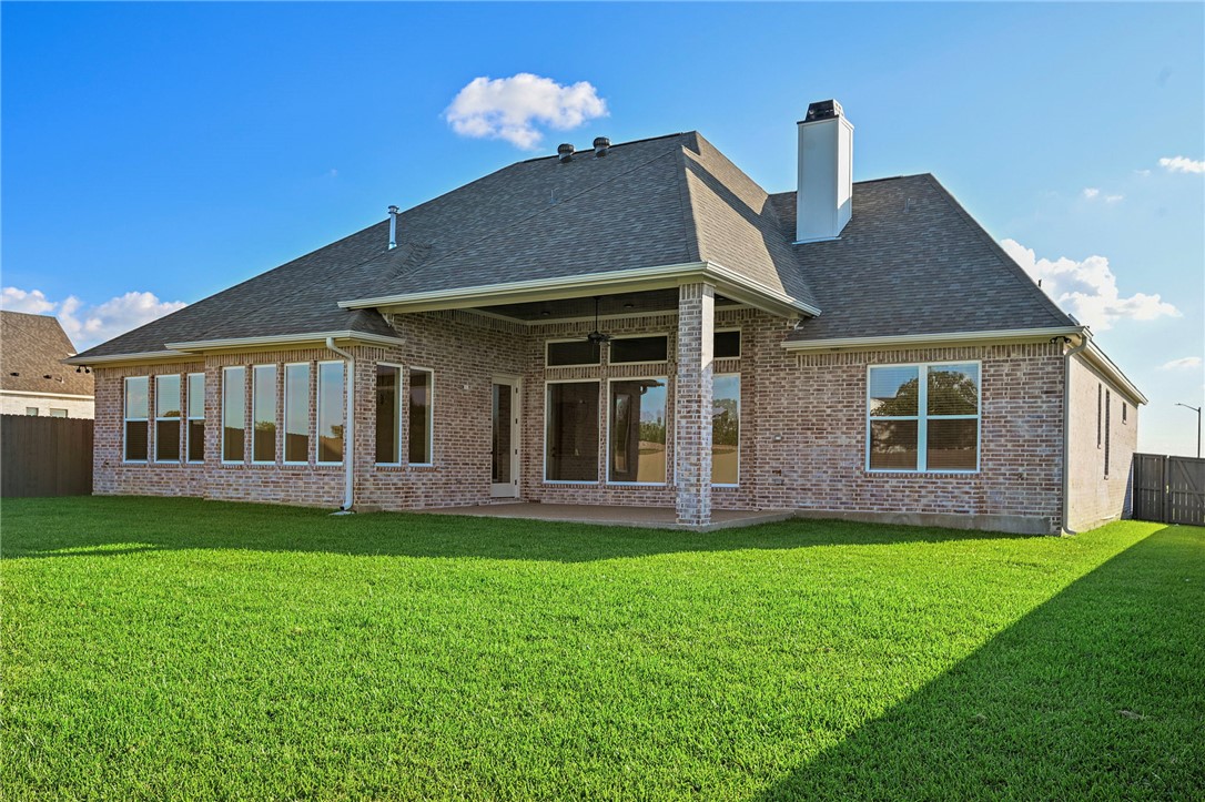 7052 Skipping Rock Path Bryan, TX 77808 - Photo 23 of 23 a front view of a house with a garden