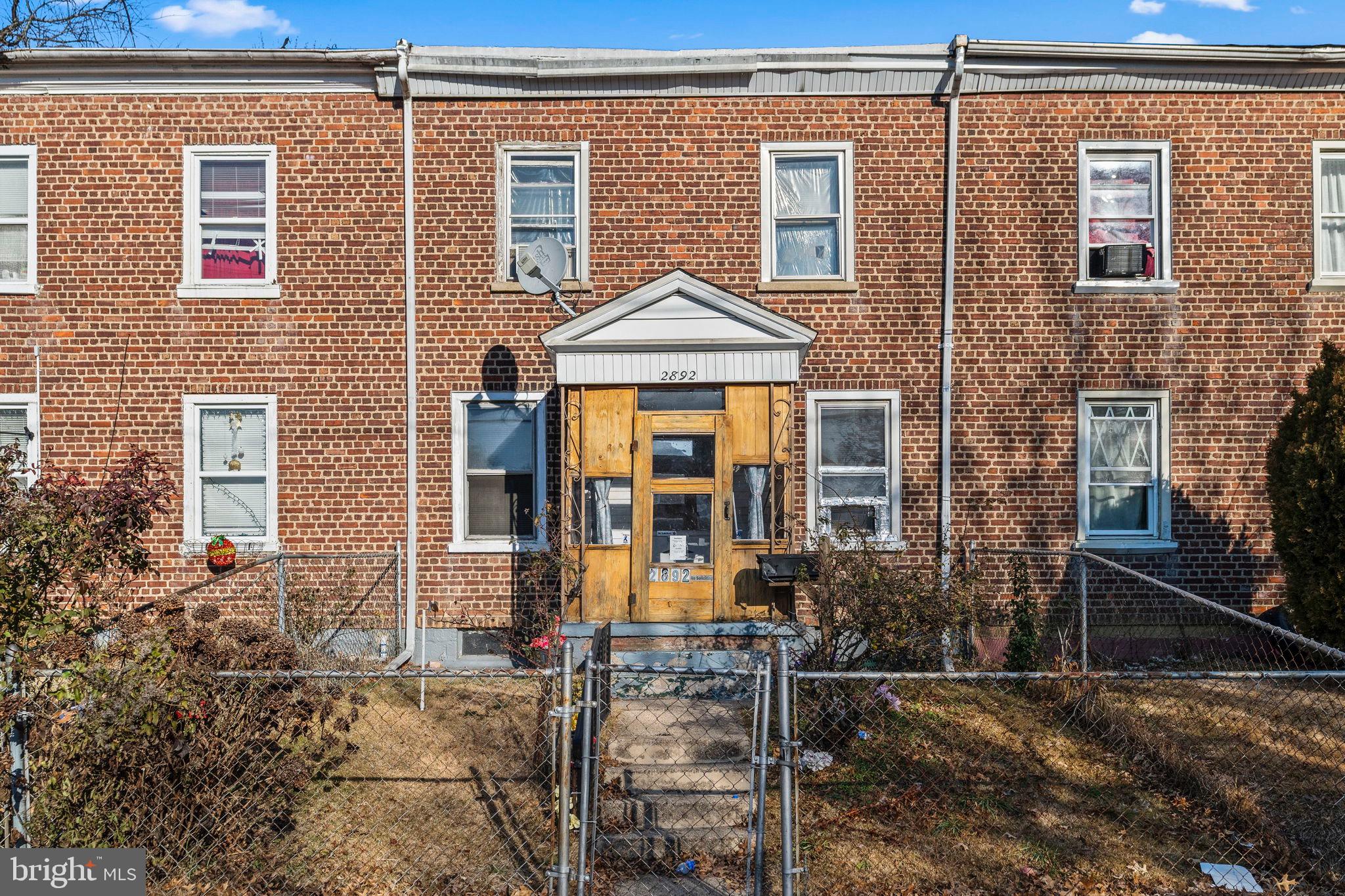 2892 North Constitution Road Camden, NJ 08104 - Photo 1 of 17 a front view of a house with many windows