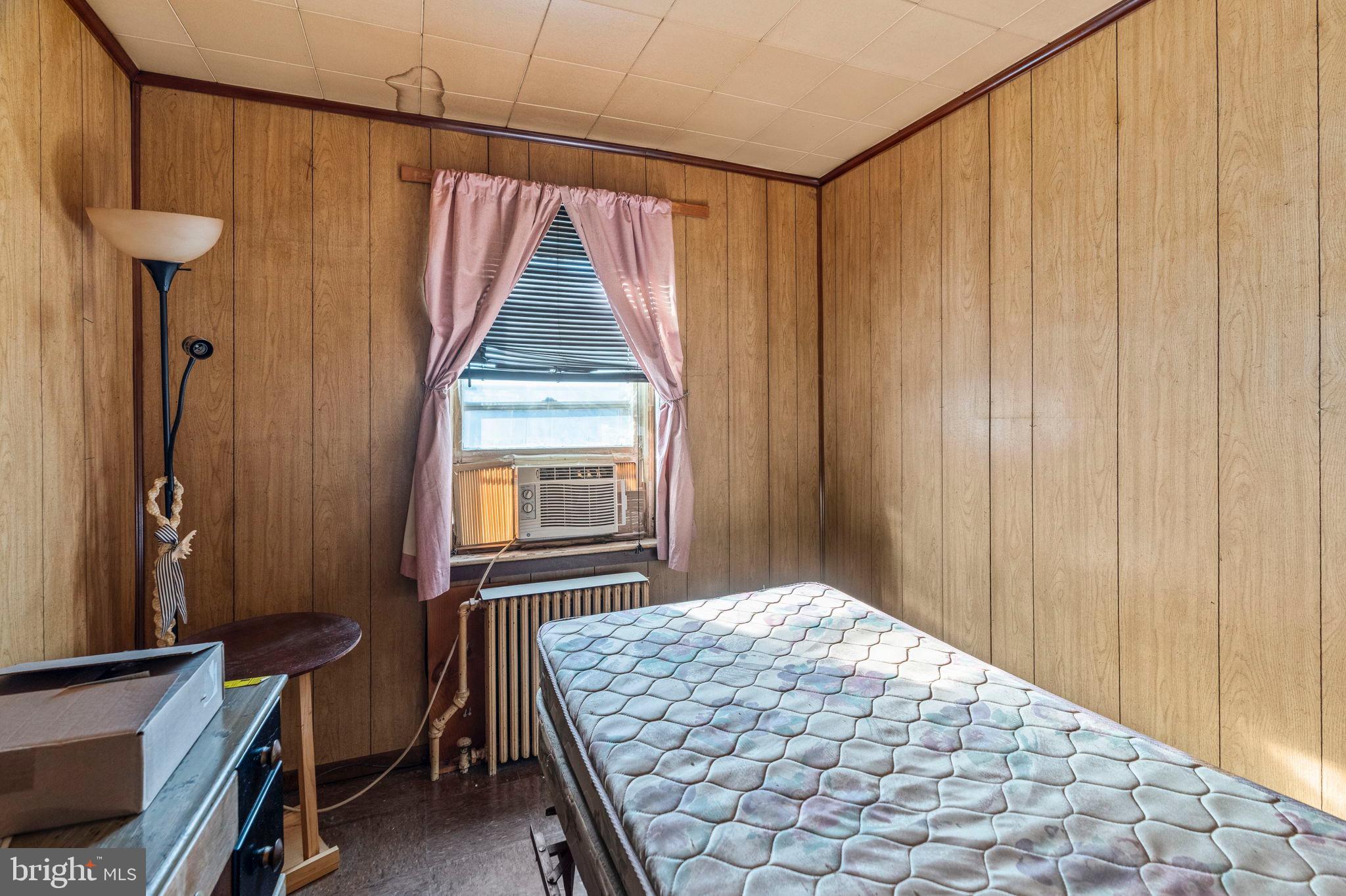 2892 North Constitution Road Camden, NJ 08104 - Photo 11 of 17 a bedroom with a bed and a window