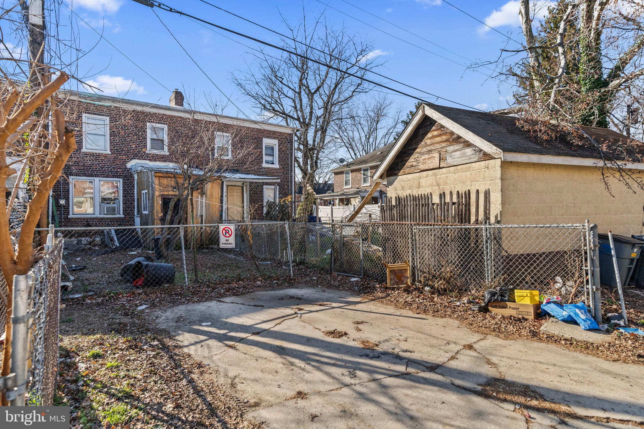 2892 North Constitution Road Camden, NJ 08104 - Photo 16 of 17 a view of a brick house with many windows and a tree