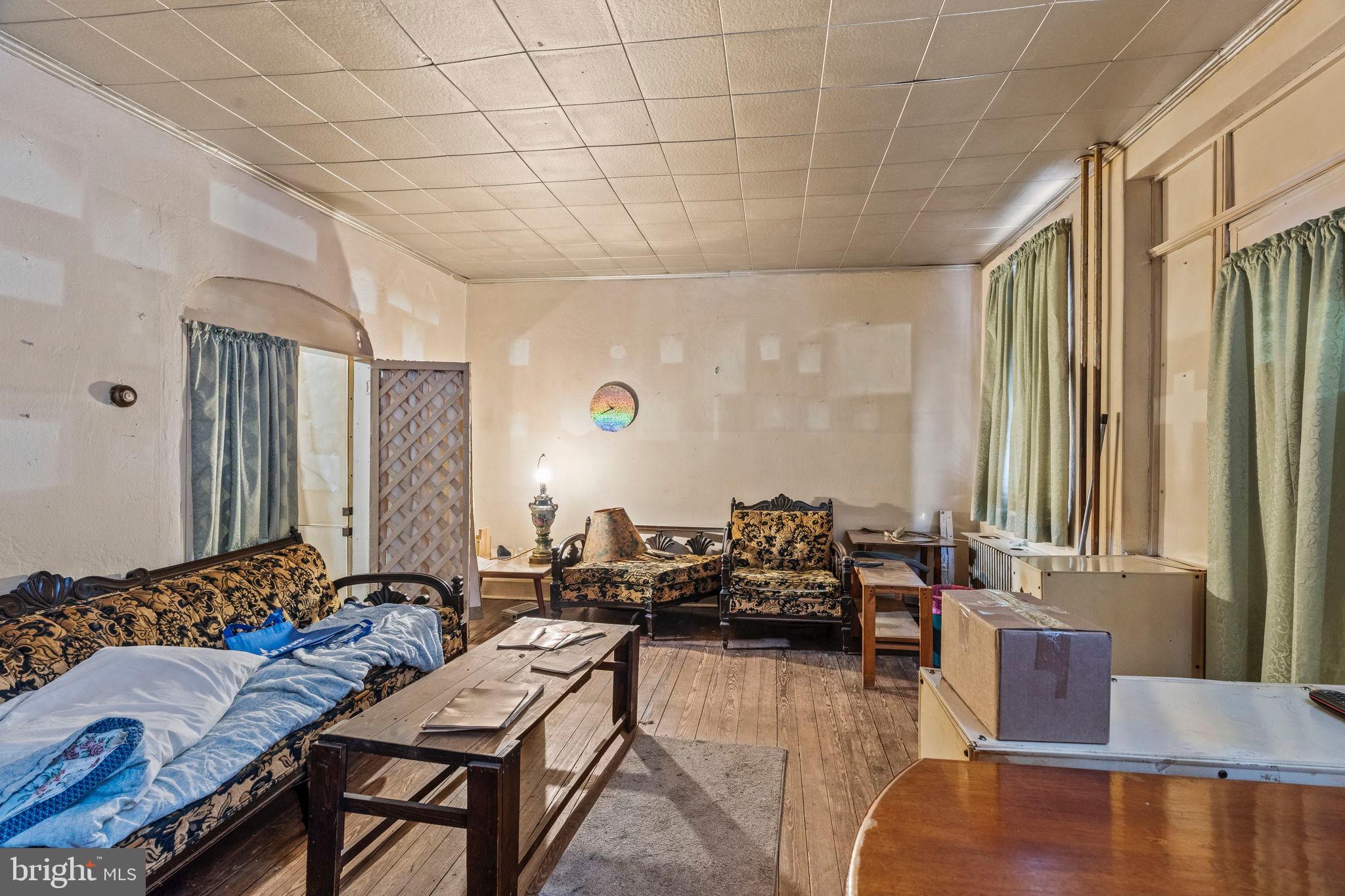 2892 North Constitution Road Camden, NJ 08104 - Photo 2 of 17 a living room with furniture and a large window