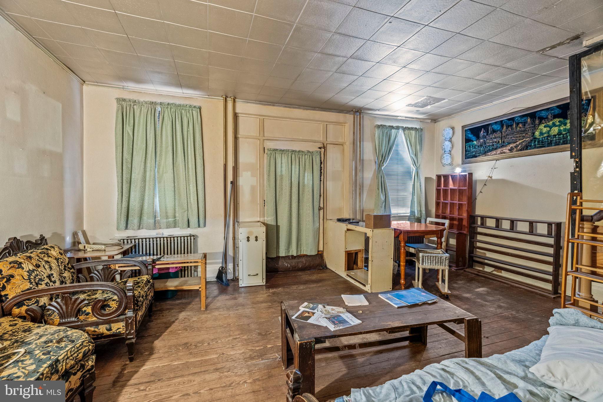 2892 North Constitution Road Camden, NJ 08104 - Photo 3 of 17 a living room with furniture and a window