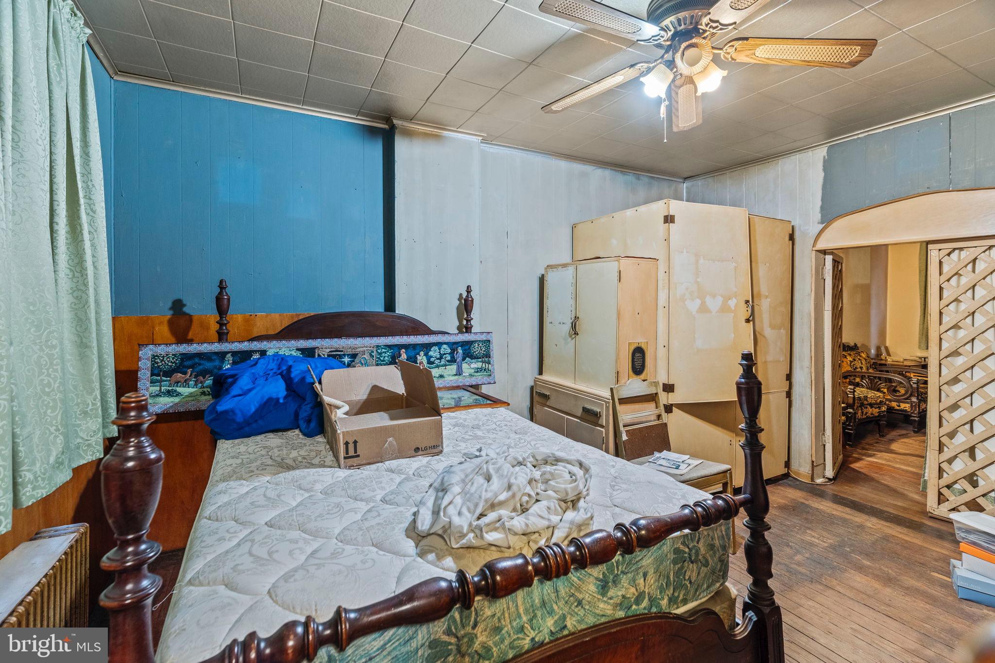 2892 North Constitution Road Camden, NJ 08104 - Photo 5 of 17 a bedroom with furniture and a chandelier