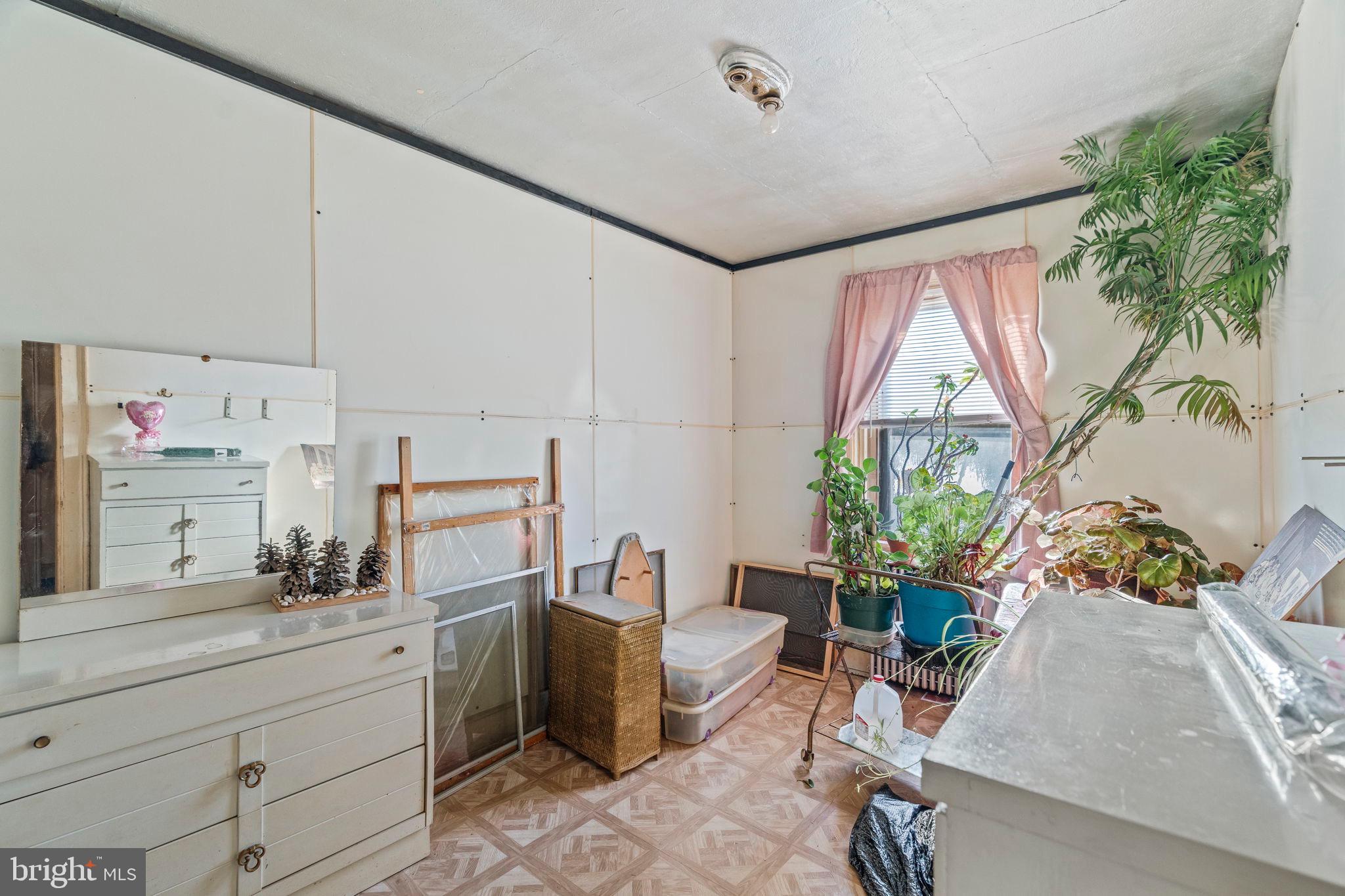 2892 North Constitution Road Camden, NJ 08104 - Photo 10 of 17 a room with storage cabinets and potted plant